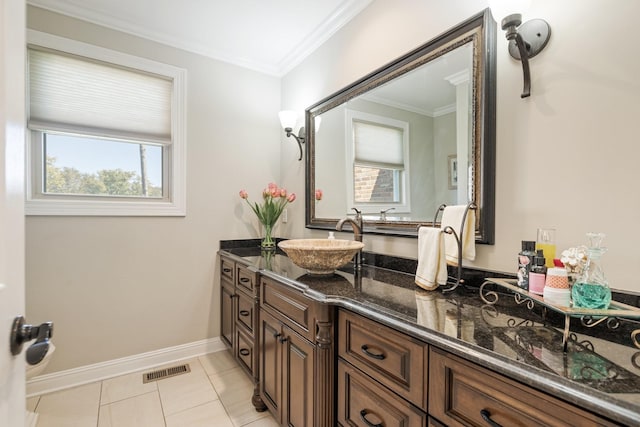 bathroom featuring tile patterned flooring, vanity, and ornamental molding