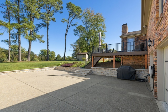 view of patio featuring a grill and a wooden deck