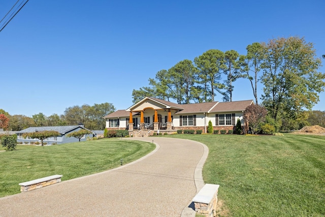 view of front of property with a front lawn and covered porch