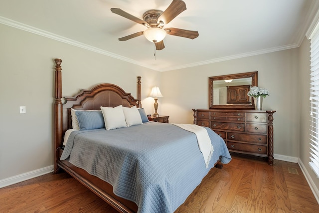 bedroom featuring hardwood / wood-style floors, ceiling fan, and crown molding