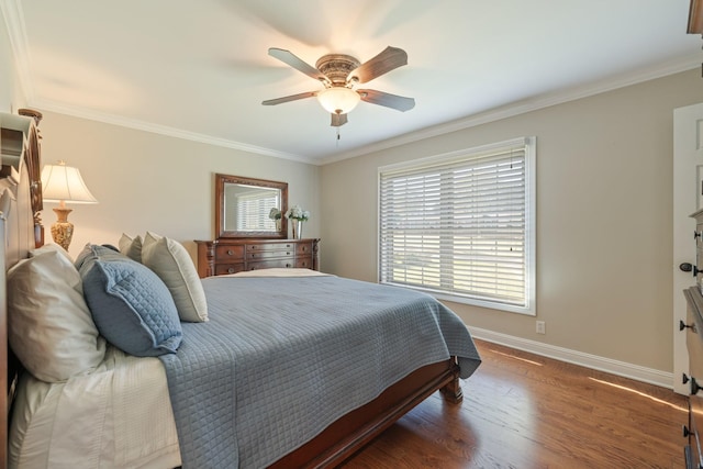 bedroom with dark hardwood / wood-style flooring, ceiling fan, and crown molding