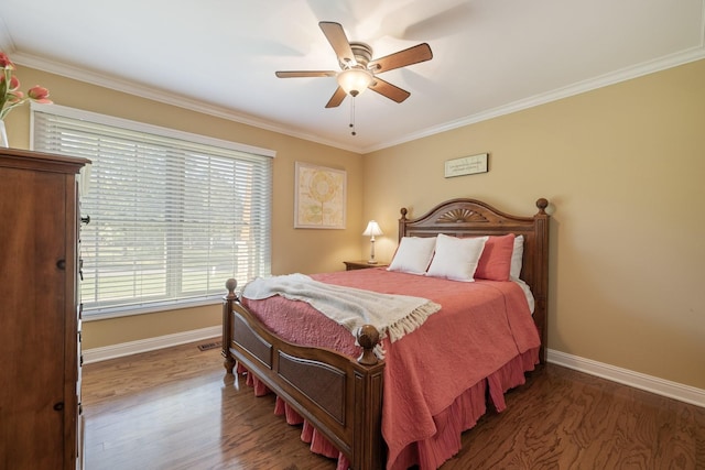 bedroom featuring ceiling fan, dark hardwood / wood-style floors, and crown molding