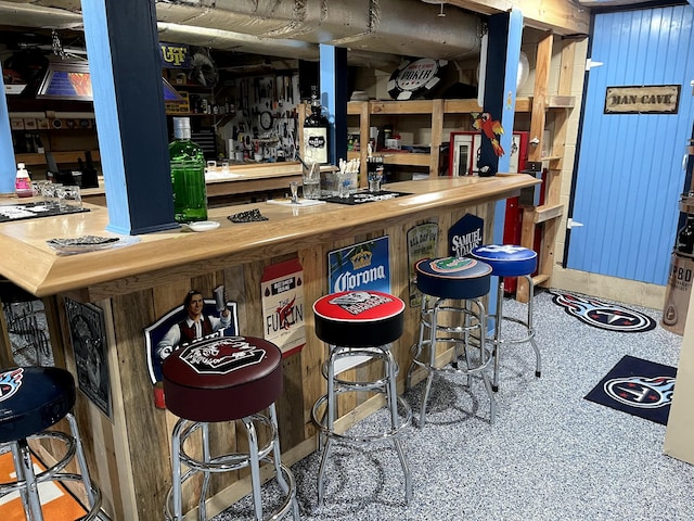 bar featuring wood walls