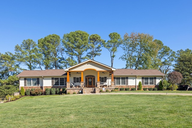 ranch-style home featuring ceiling fan, a porch, and a front lawn