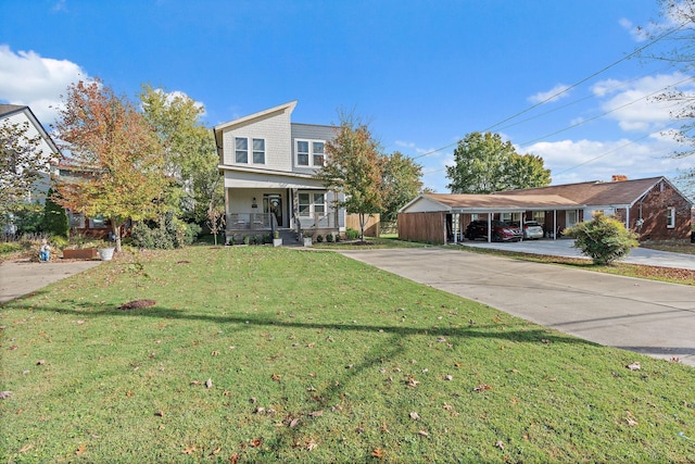 view of front of property with a front lawn, covered porch, and a carport