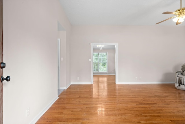 empty room with ceiling fan and light wood-type flooring