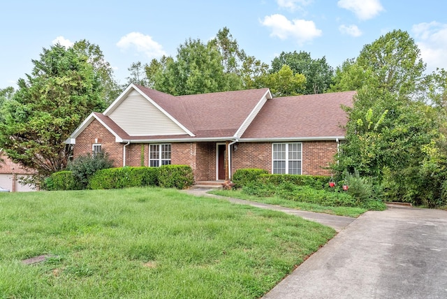 ranch-style home with a front lawn