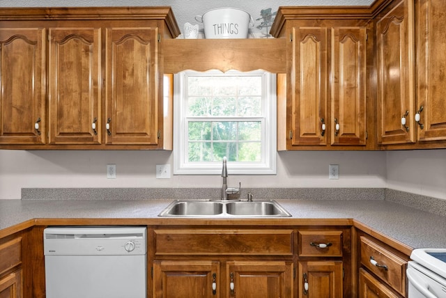 kitchen with range, dishwasher, and sink