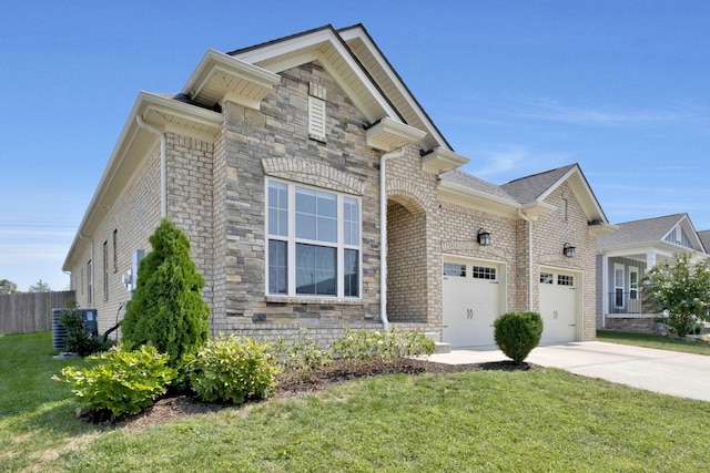 view of front of house featuring a front yard and a garage