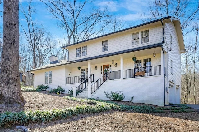 view of front of home with a garage and covered porch