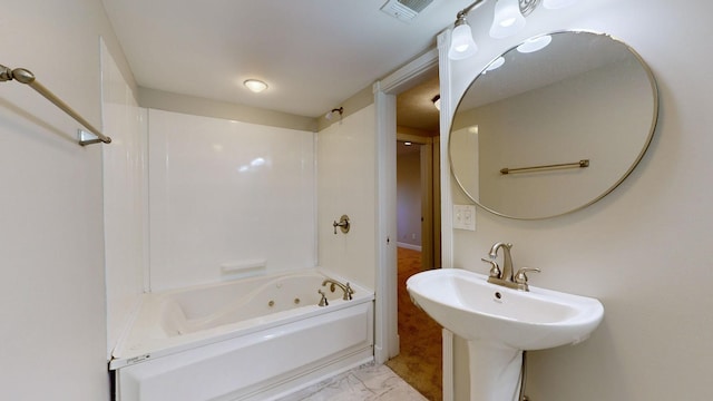 bathroom featuring bathtub / shower combination and sink