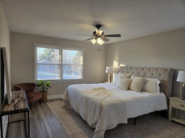 bedroom with hardwood / wood-style floors and ceiling fan