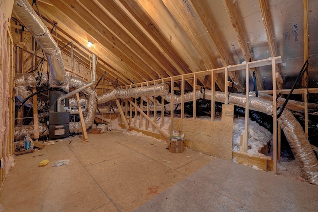 unfinished attic featuring heating unit