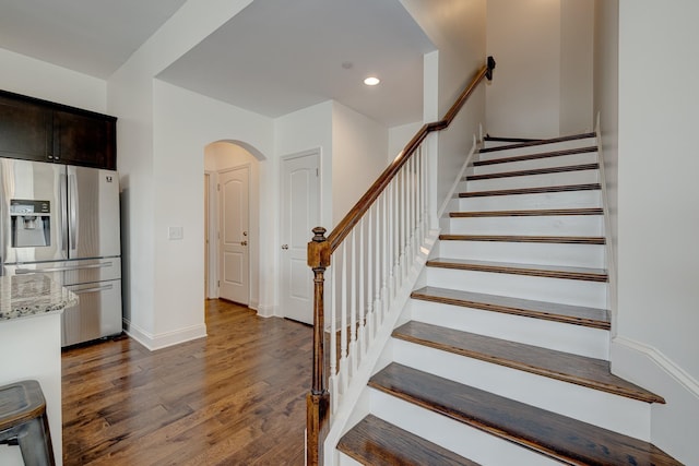 stairs with hardwood / wood-style floors