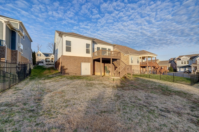 rear view of house with a wooden deck