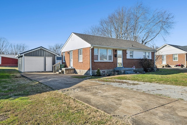 view of front of home with an outbuilding, a garage, and a front yard