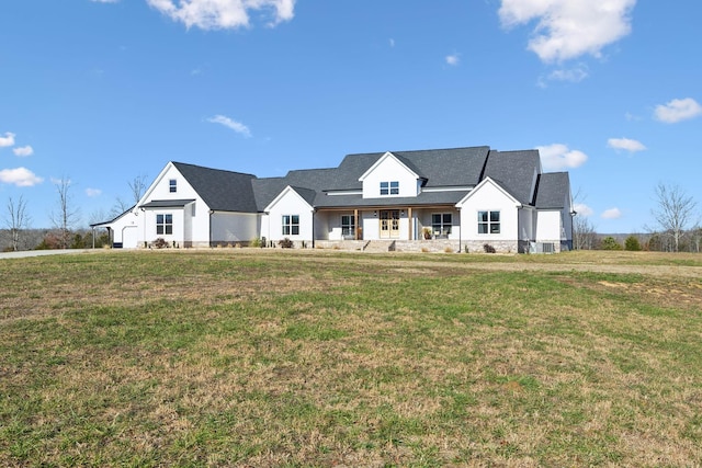 modern farmhouse style home featuring a front lawn