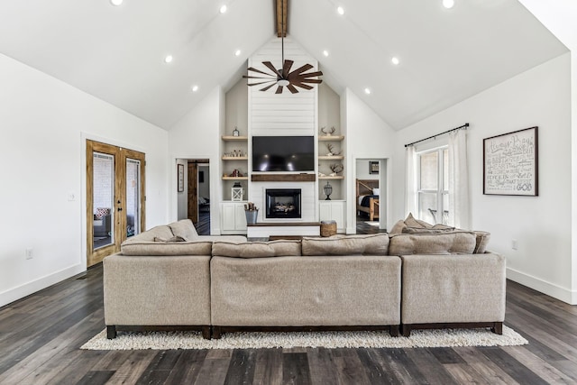 living room featuring beamed ceiling, dark hardwood / wood-style floors, built in features, and high vaulted ceiling