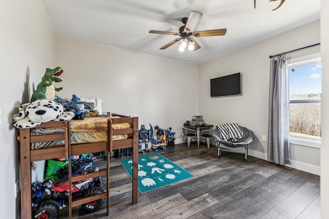 bedroom featuring ceiling fan and dark wood-type flooring