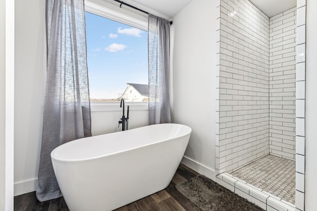 bathroom with wood-type flooring and plus walk in shower