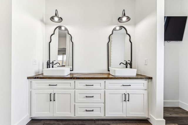 bathroom featuring hardwood / wood-style floors and vanity