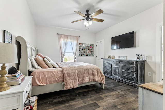 bedroom with ceiling fan and dark wood-type flooring