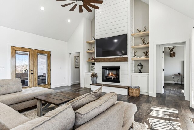 living room with ceiling fan, french doors, built in features, high vaulted ceiling, and dark hardwood / wood-style floors