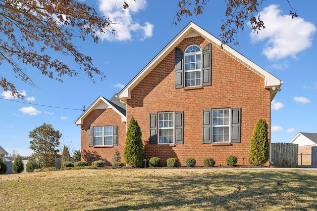 view of home's exterior with a yard