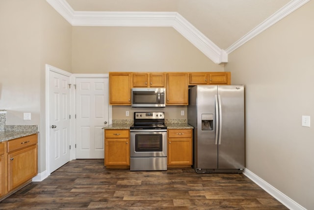 kitchen featuring light stone counters, ornamental molding, and appliances with stainless steel finishes