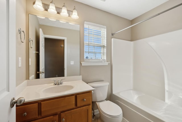 full bathroom featuring vanity, toilet, and washtub / shower combination