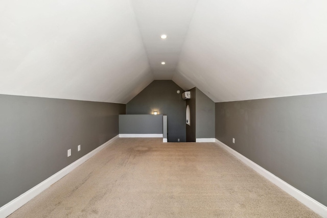 bonus room featuring lofted ceiling and carpet floors