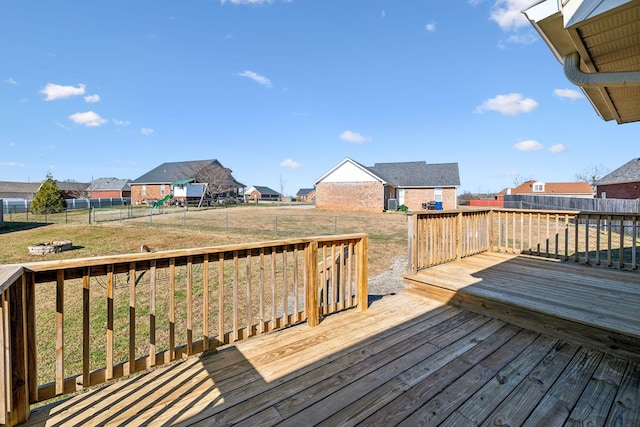 wooden terrace with a lawn