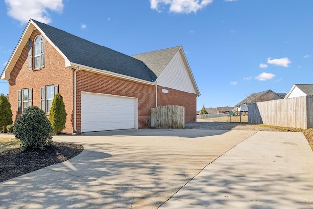 view of side of home with a garage