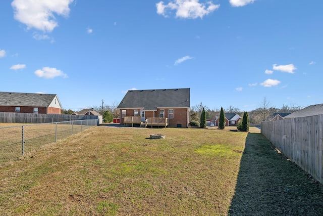 view of yard with a wooden deck