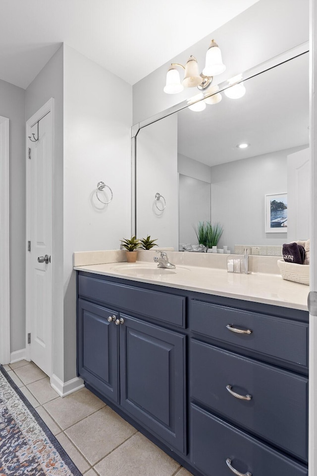 bathroom with tile patterned floors and vanity