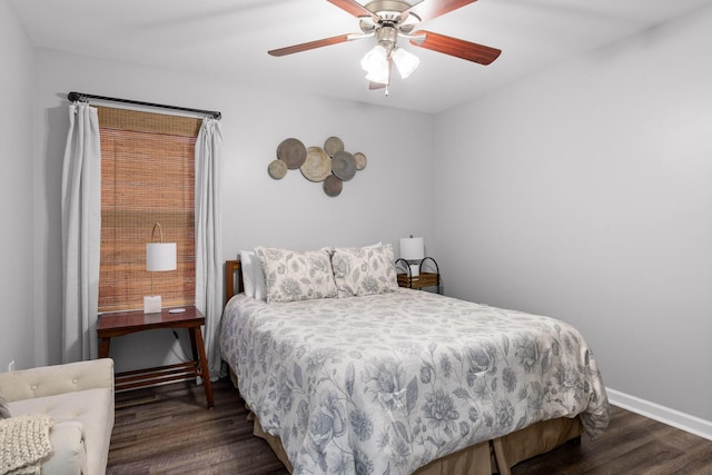 bedroom featuring dark hardwood / wood-style flooring and ceiling fan