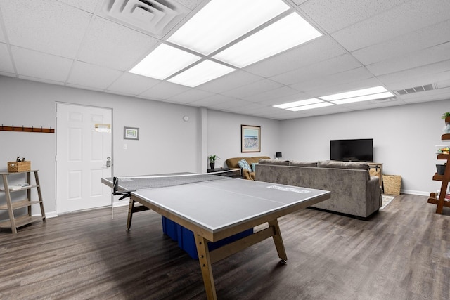 recreation room with dark wood-type flooring and a drop ceiling