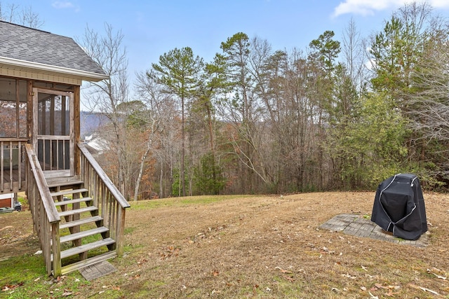 view of yard featuring a sunroom