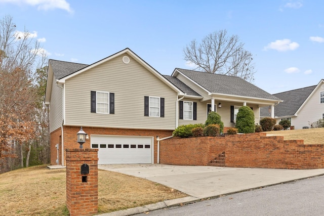 view of front of home featuring a garage and a front lawn