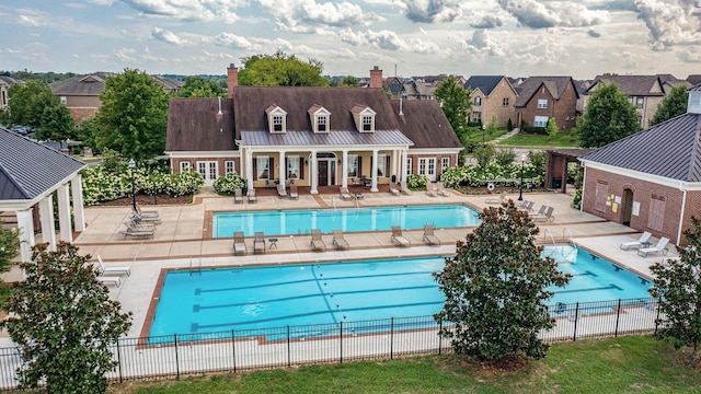 view of swimming pool featuring a patio area