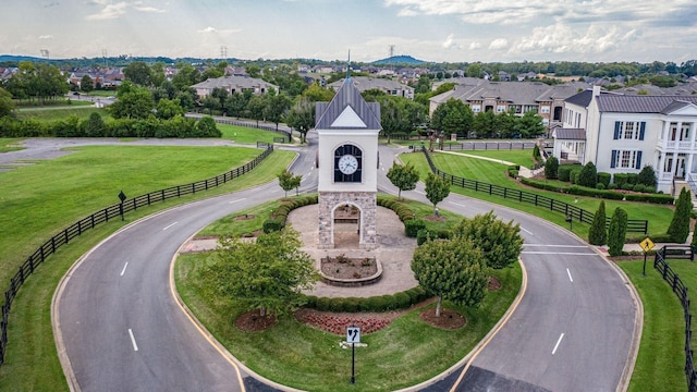 view of home's community with a lawn