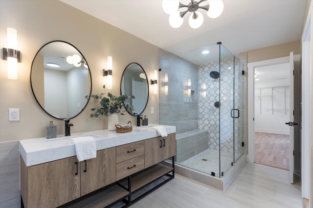 bathroom featuring vanity and an enclosed shower