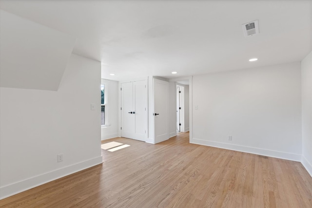 spare room with light hardwood / wood-style floors