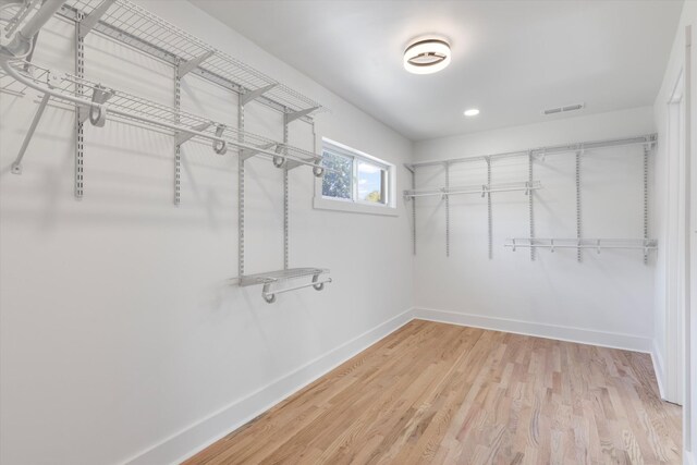 walk in closet featuring hardwood / wood-style floors