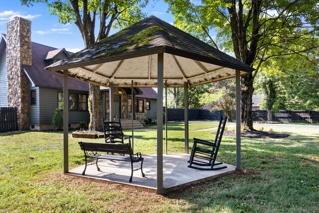 view of home's community with a gazebo and a yard