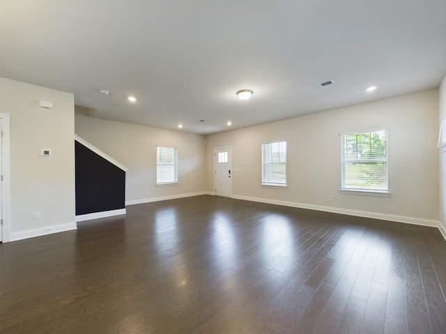 spare room with dark wood-type flooring