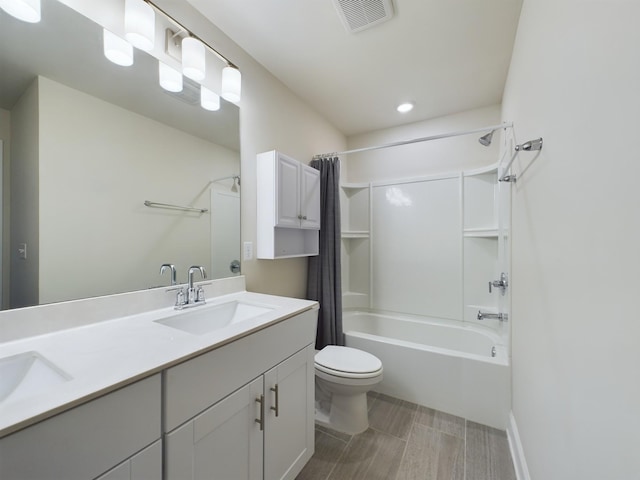 full bathroom with vanity, toilet, and shower / bath combo with shower curtain