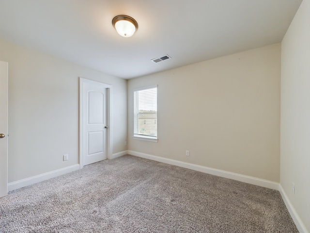 spare room featuring carpet flooring