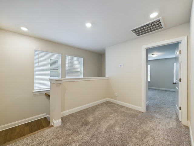 empty room with light colored carpet