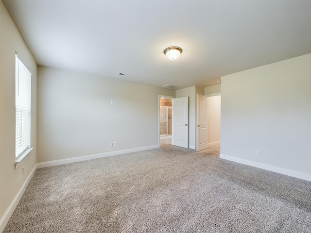 empty room with light colored carpet